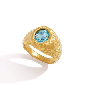 Textured gold-tone ring with blue oval stone