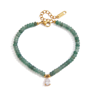 Green beaded bracelet with clear teardrop charm