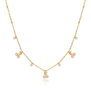 Gold-tone fine-chain necklace with three zircon-accented cherry charms and four dangling round stone accents