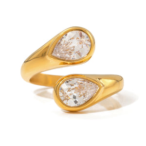 Gold-tone open ring with two clear teardrop stones in bezel settings