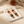 Carnelian, Tiger’s Eye & Zircon Drop Earrings on the cream simple pouch