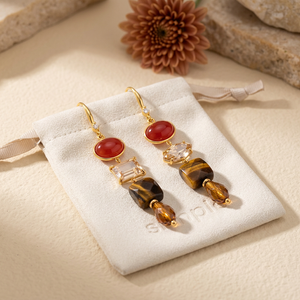 Carnelian, Tiger’s Eye & Zircon Drop Earrings on the cream simple pouch