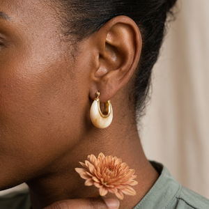 Cream marble resin huggie earrings lifestyle image