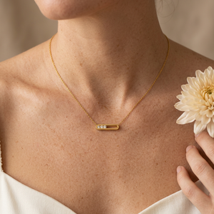 Everyday Bar Necklace lifestyle close-up with an ivory chrysanthemum