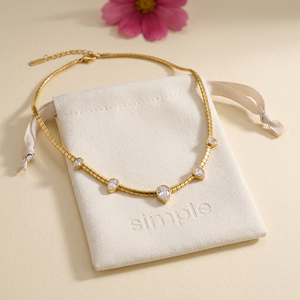 Five-Teardrop Zircon Snake Chain Necklace on the original simple pouch with raspberry cosmos