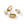Gold zircon huggie earrings showing an attached round charm and detached hoop and charm on a white background