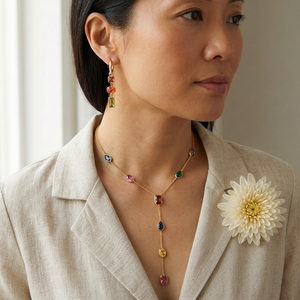Necklace and earrings lifestyle image with linen-colored blouse