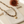 Sahara Jasper necklace on the cream simple pouch with a blurred autumn flower