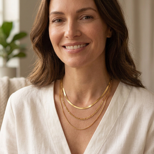 Square lifestyle image of a woman wearing the layered gold necklace