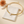Teardrop Zircon Collar Necklace on the original simple pouch with a peach chrysanthemum