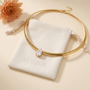 Teardrop Zircon Collar Necklace on the original simple pouch with a peach chrysanthemum