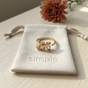 Topaz & Crystal-Tone Zircon Open Ring on the cream simple pouch