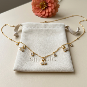 Zircon Cherry Charm Necklace on pouch