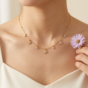 Zircon Stars Necklace lifestyle close-up with a lavender aster