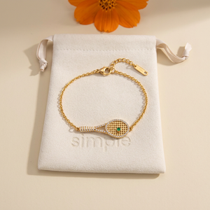 Zircon Tennis Racket Charm Bracelet on the original simple pouch with orange cosmos