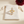 Zircon Triple-Shape Adjustable Ring on the original simple pouch with a burgundy dahlia